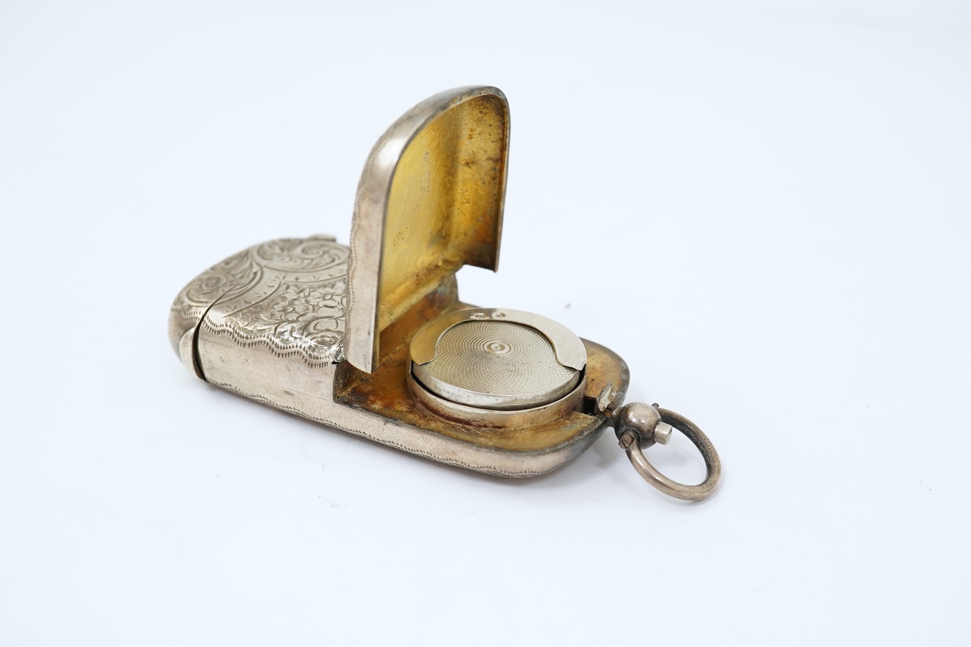 A late Victorian engraved silver oval combination sovereign and vesta case, by JW